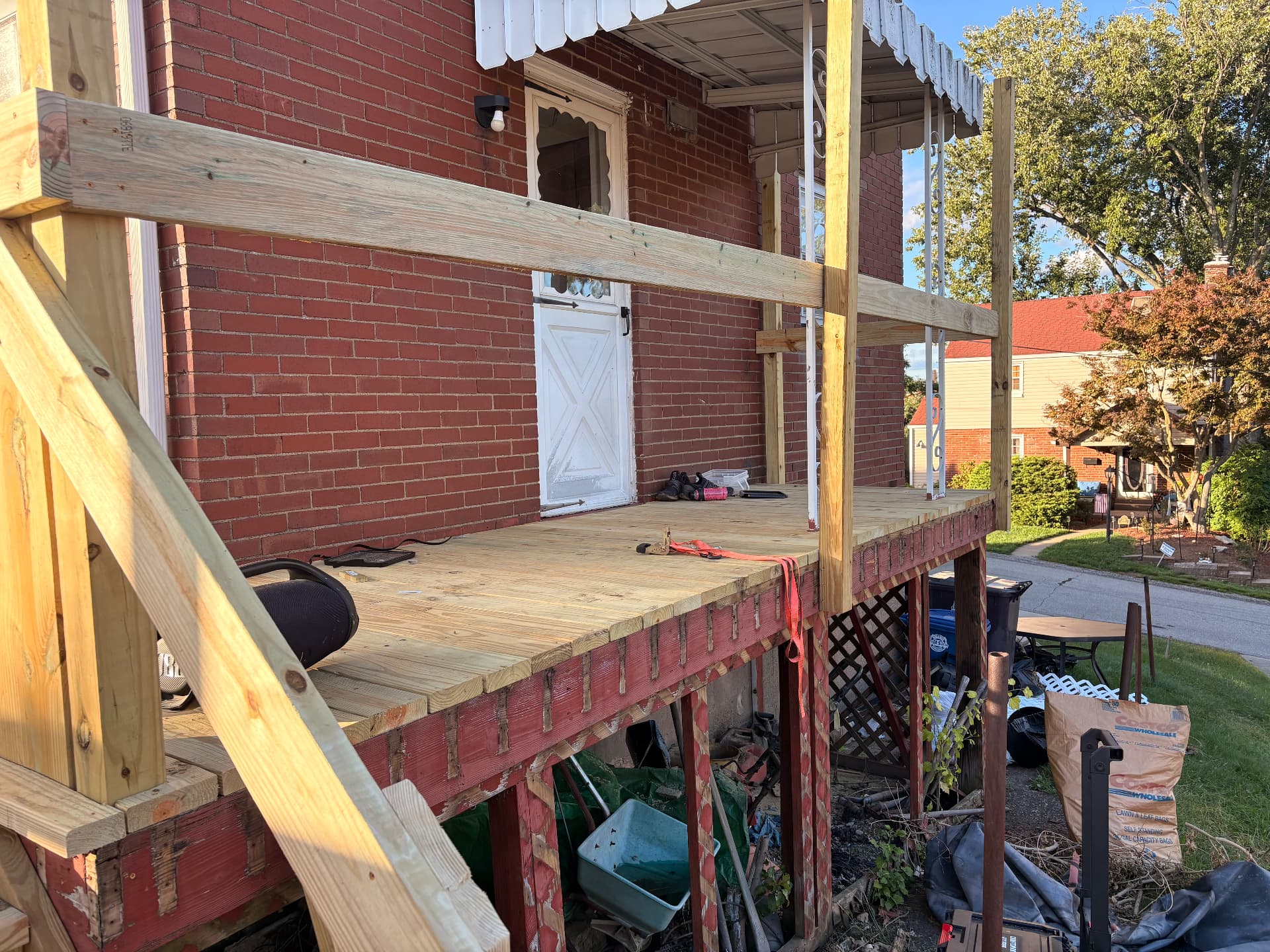 Newly rebuilt front landing with decking and support posts